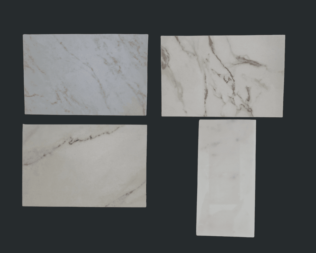 Side by side comparison of neutral stone samples for bathroom countertops.
